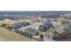 An aerial view of houses in a Gathering-friendly neighborhood surrounded by a wooden fence at 3309 Thornwood Ct, Castle Rock, CO 80108