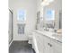 Bright bathroom featuring a double sink, a shower and a clean white interior at 3309 Thornwood Ct, Castle Rock, CO 80108