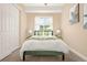 Bright bedroom with modern decor, soft carpet, green bed, lots of light, and calming color palette at 3309 Thornwood Ct, Castle Rock, CO 80108
