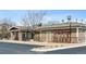 Exterior view of 'The Ridge House' with stone accents, benches, and convenient parking at 3309 Thornwood Ct, Castle Rock, CO 80108