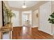 Elegant foyer boasts gleaming hardwood floors, decorative accents, and inviting views to living spaces at 3309 Thornwood Ct, Castle Rock, CO 80108