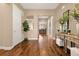 Inviting foyer featuring hardwood floors, neutral paint, and decorative console table with accents at 3309 Thornwood Ct, Castle Rock, CO 80108
