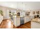 Open kitchen with granite counters, stainless appliances, breakfast bar and dining area with backyard views at 3309 Thornwood Ct, Castle Rock, CO 80108