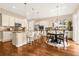 Spacious eat-in kitchen featuring granite counters, stainless appliances, kitchen island and breakfast bar with stools at 3309 Thornwood Ct, Castle Rock, CO 80108