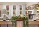 Cozy living room showcases a fireplace and a window that looks out onto the yard at 3309 Thornwood Ct, Castle Rock, CO 80108