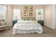 The main bedroom showcases a bamboo headboard, ample natural light, and neutral color scheme at 3309 Thornwood Ct, Castle Rock, CO 80108