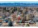 Aerial view of neighborhood with tree coverage and mountain views in the background at 6851 S Franklin St, Centennial, CO 80122