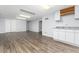 Large finished basement with vinyl floors, kitchenette area, and plenty of room for recreation at 6851 S Franklin St, Centennial, CO 80122