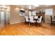 Elegant dining room with hardwood floors, a brick fireplace, and ample natural light at 6851 S Franklin St, Centennial, CO 80122