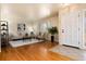 Cozy living room with hardwood floors, neutral furniture, and ample natural light from shuttered windows at 6851 S Franklin St, Centennial, CO 80122