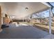 Covered patio with concrete slab and views of the fenced backyard and mature trees at 6851 S Franklin St, Centennial, CO 80122