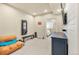 Finished basement area with a couch and workout equipment at 11235 S Neu Towne Cir, Parker, CO 80134