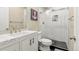 Stylish bathroom featuring marble counters, a shower with glass doors, and sleek fixtures at 11235 S Neu Towne Cir, Parker, CO 80134