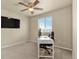 Bedroom with a ceiling fan, a window with blinds, and a desk setup at 11235 S Neu Towne Cir, Parker, CO 80134