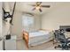 Cozy bedroom with a twin bed, ceiling fan, and mounted television at 11235 S Neu Towne Cir, Parker, CO 80134