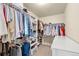 Spacious walk-in closet with ample storage and a variety of clothing at 11235 S Neu Towne Cir, Parker, CO 80134