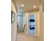 Hallway with views of a staircase, artwork, and a bedroom with a plush bed at 11235 S Neu Towne Cir, Parker, CO 80134