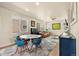 Bright living room featuring hardwood floors, ample natural light, and a comfortable seating area at 11235 S Neu Towne Cir, Parker, CO 80134