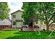 Spacious backyard featuring a patio and lush lawn, perfect for outdoor living and entertaining at 7245 Prairie Cir, Longmont, CO 80504
