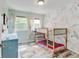 Bright bedroom with stylish floral wallpaper and cozy bunkbeds at 7245 Prairie Cir, Longmont, CO 80504