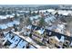 Aerial view of a townhouse complex covered in winter snow and landscaping at 4771 White Rock Cir # C, Boulder, CO 80301