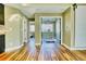 Bright hallway featuring wood floors and entryways to adjoining rooms and a bedroom at 4771 White Rock Cir # C, Boulder, CO 80301