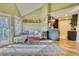 Well-lit living room features a sliding glass door to the balcony and an open transition to the kitchen at 4771 White Rock Cir # C, Boulder, CO 80301