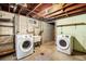 Functional laundry area with new washer and dryer units and utility sink at 2064 Ironton St, Aurora, CO 80010
