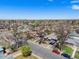 Neighborhood street view with well-maintained homes and mature trees in a residential area at 2064 Ironton St, Aurora, CO 80010