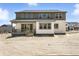 Exterior view of the home with a covered porch and yard at 1733 Fox Trotter Pt, Castle Rock, CO 80104