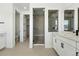 Contemporary bathroom showcasing a glass-enclosed shower, double vanity, and modern fixtures at 1733 Fox Trotter Pt, Castle Rock, CO 80104