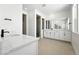 Bright bathroom with double vanity, stone countertops and modern shower at 1733 Fox Trotter Pt, Castle Rock, CO 80104