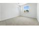 Bright bedroom features neutral carpet, clean white walls, and dual windows for natural light at 1733 Fox Trotter Pt, Castle Rock, CO 80104