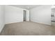 Large bedroom features plush carpeting and a doorway to an en suite bathroom at 1733 Fox Trotter Pt, Castle Rock, CO 80104