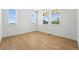 Bright, spacious bedroom with beautiful wood floors and large windows offering plenty of natural light at 1733 Fox Trotter Pt, Castle Rock, CO 80104