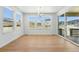 Sunlit dining room featuring hardwood floors and many windows with neighborhood views at 1733 Fox Trotter Pt, Castle Rock, CO 80104