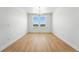 Large dining room with wood floors and large windows, perfect for entertaining at 1733 Fox Trotter Pt, Castle Rock, CO 80104
