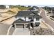 Stunning two-story home boasting a three car garage, manicured landscaping, and modern architectural details at 1733 Fox Trotter Pt, Castle Rock, CO 80104
