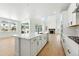 Open-concept kitchen with a central island, modern appliances, and an airy, well-lit atmosphere at 1733 Fox Trotter Pt, Castle Rock, CO 80104