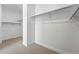 Spacious walk-in closet providing ample storage with rods installed at 1733 Fox Trotter Pt, Castle Rock, CO 80104