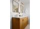 Bathroom with a double vanity featuring bronze fixtures and a marble countertop, perfect for modern comfort at 3930 S Spruce St, Denver, CO 80237