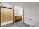 The remodeled bathroom includes a tile shower and modern vanity at 3930 S Spruce St, Denver, CO 80237