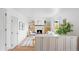 Bright living room features a fireplace, built-in shelving and wooden flooring at 3930 S Spruce St, Denver, CO 80237