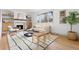 Bright living room featuring a fireplace, modern furniture, and large windows at 3930 S Spruce St, Denver, CO 80237