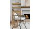 Cozy armchair with a blanket near a fireplace with built-in shelves at 3930 S Spruce St, Denver, CO 80237