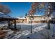 View of the backyard with gazebo and snow at 900 Emerald St, Broomfield, CO 80020