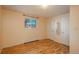 Bright bedroom with hardwood floors and a window at 900 Emerald St, Broomfield, CO 80020