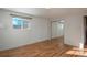 Simple bedroom with hardwood floors and mirrored closet at 900 Emerald St, Broomfield, CO 80020