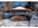 Wooden gazebo in the backyard, perfect for relaxing at 900 Emerald St, Broomfield, CO 80020