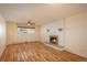 Bright living room with hardwood floors and fireplace at 900 Emerald St, Broomfield, CO 80020